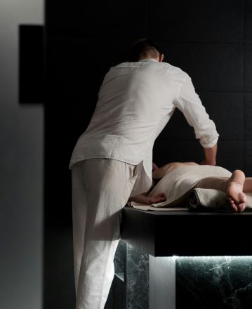 A relaxing massage in a spa setting focusing on soothing therapy and wellbeing.